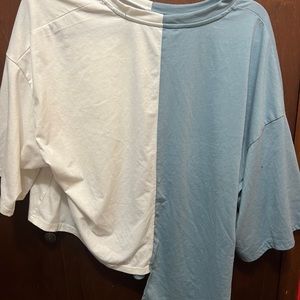 Half blue and white shirt. High low style and is light feeling.